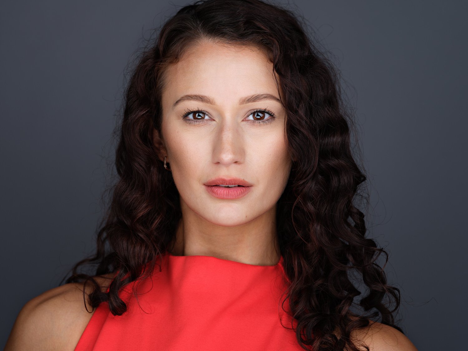 Headshot of a model in neutral backdrop