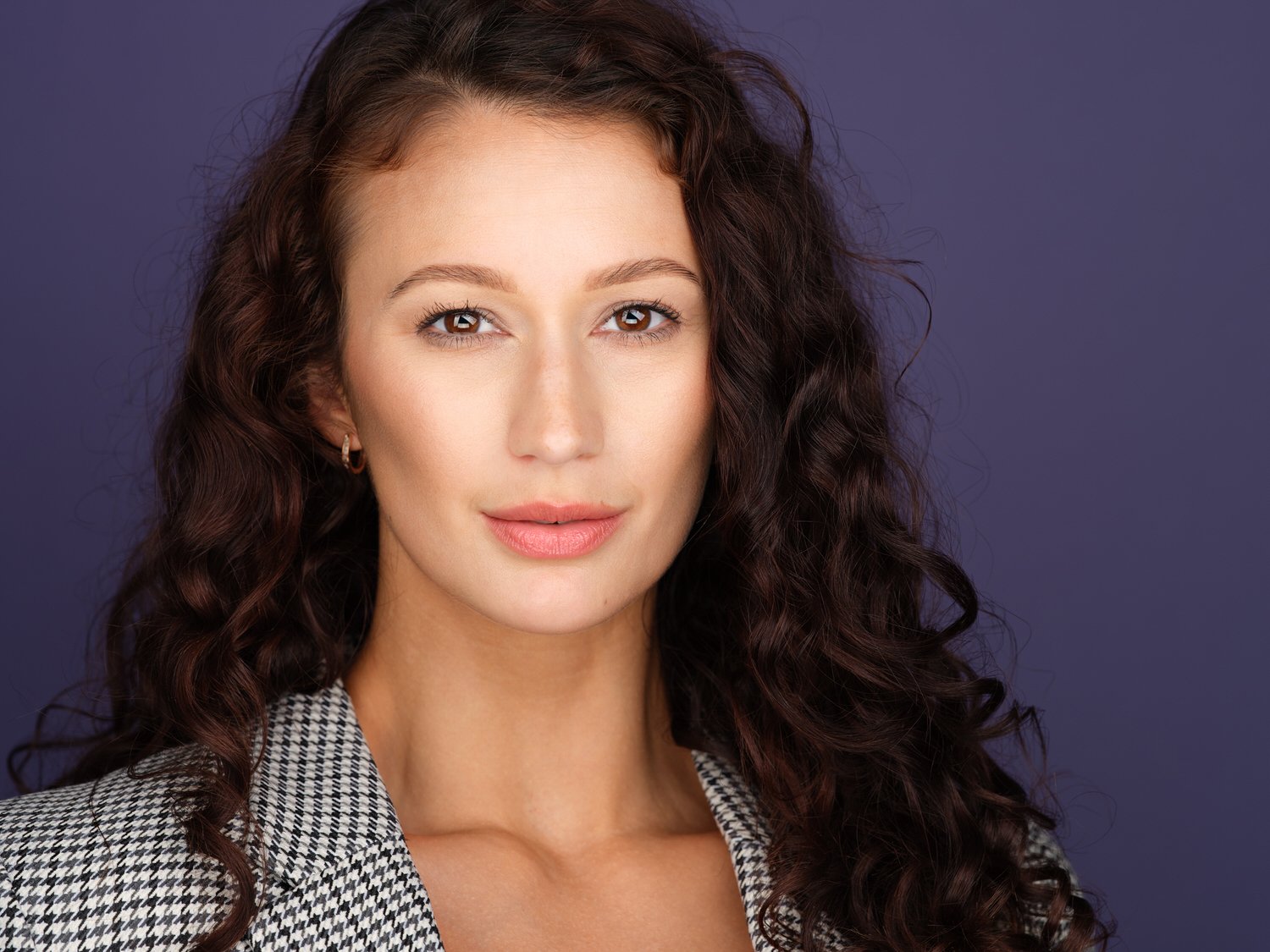 Headshot of a model in purple backdrop