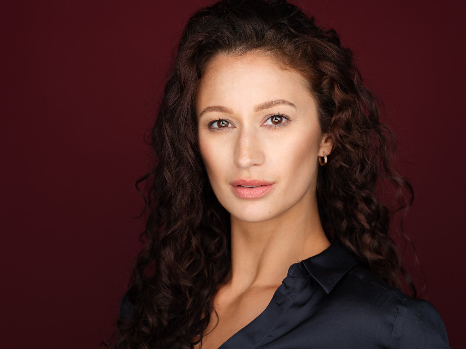 Headshot of a model in velvet backdrop