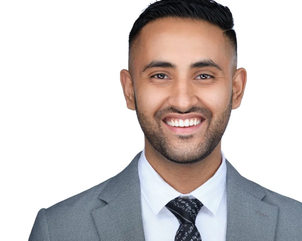 Corporate headshot of a man in a light grey suit and patterned tie, Toronto team headshot session