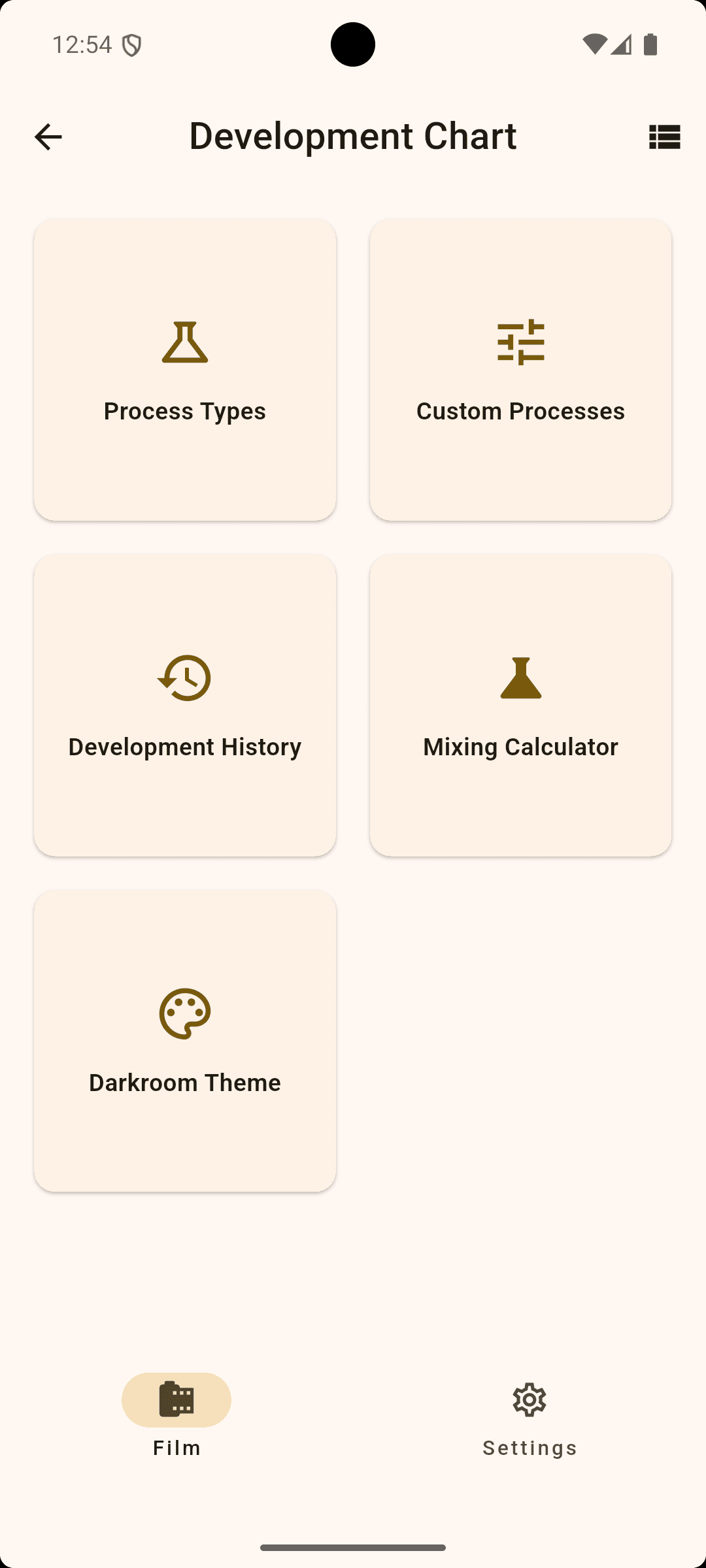 Mobile app screen displaying a development chart with options for Process Types, Custom Processes, Development History, Mixing Calculator, and Darkroom Theme, with navigation icons for Film and Settings at the bottom.