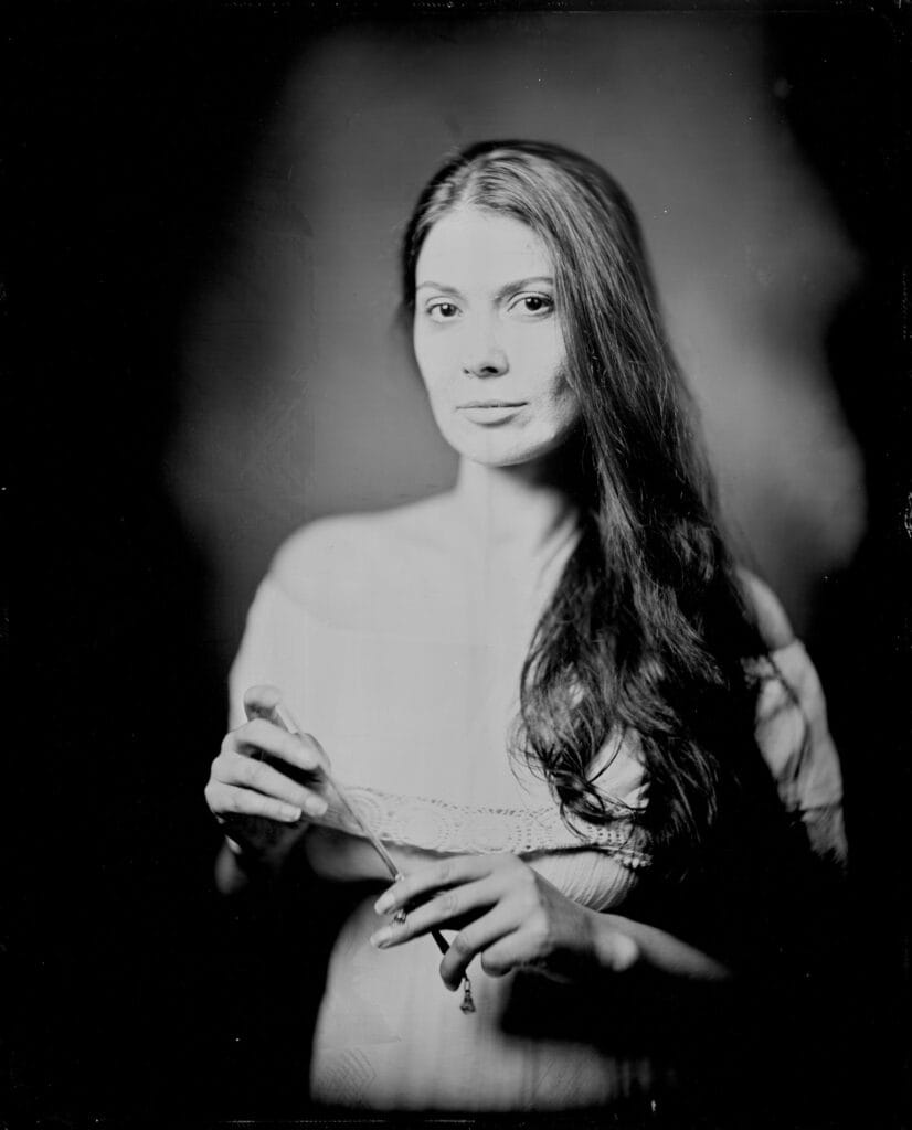 Wet plate collodion tintype portrait of a woman in an off-the-shoulder lace top, hand-poured 8x10 plate made in a Toronto studio
